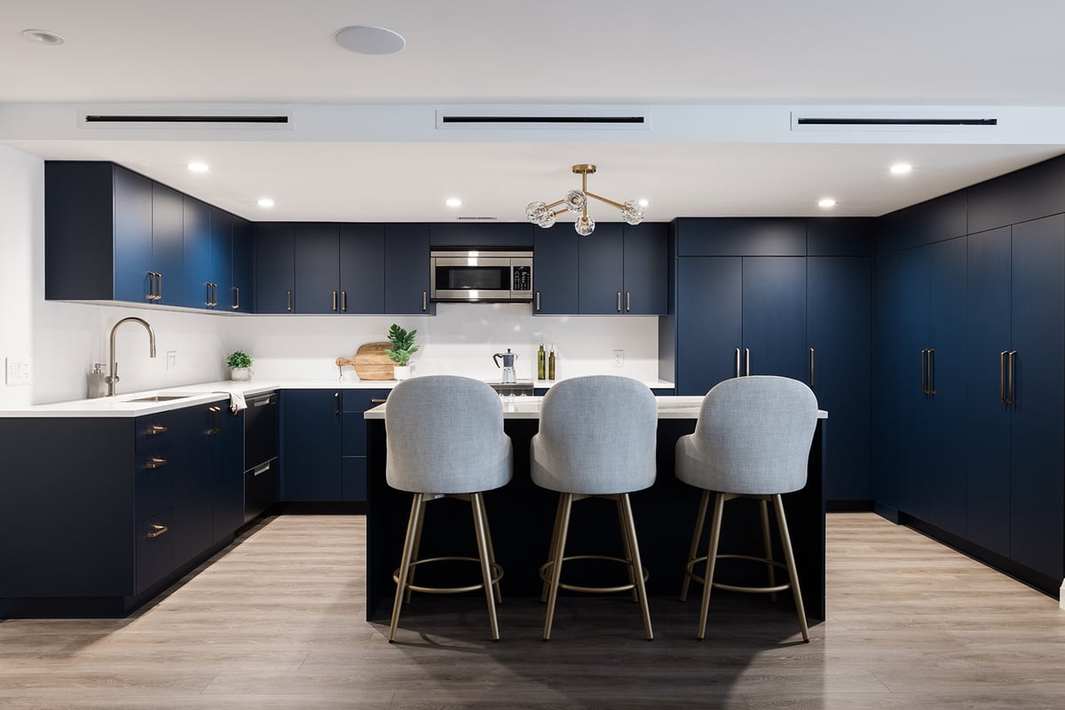 View of chairs at kitchen island in open-concept Toronto full condo renovation