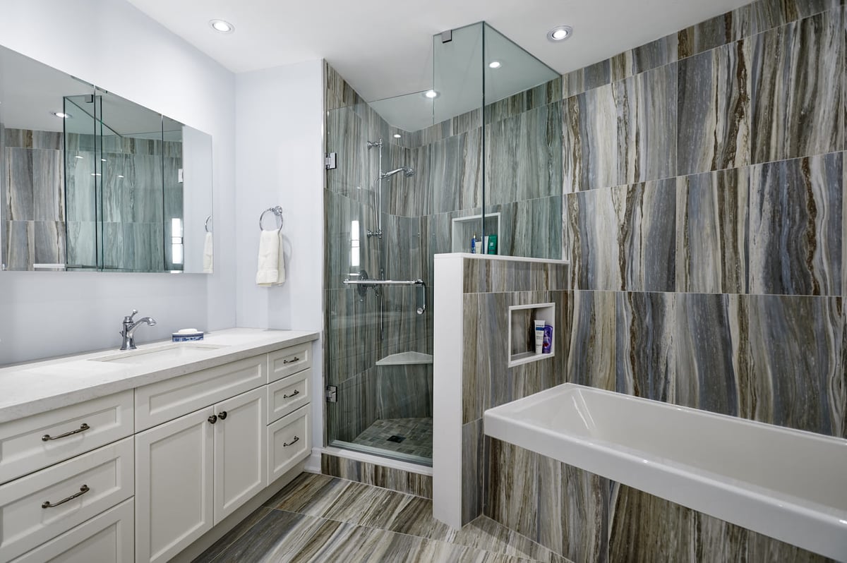 Luxury bathroom renovation in Toronto condo with built-in vanity with storage