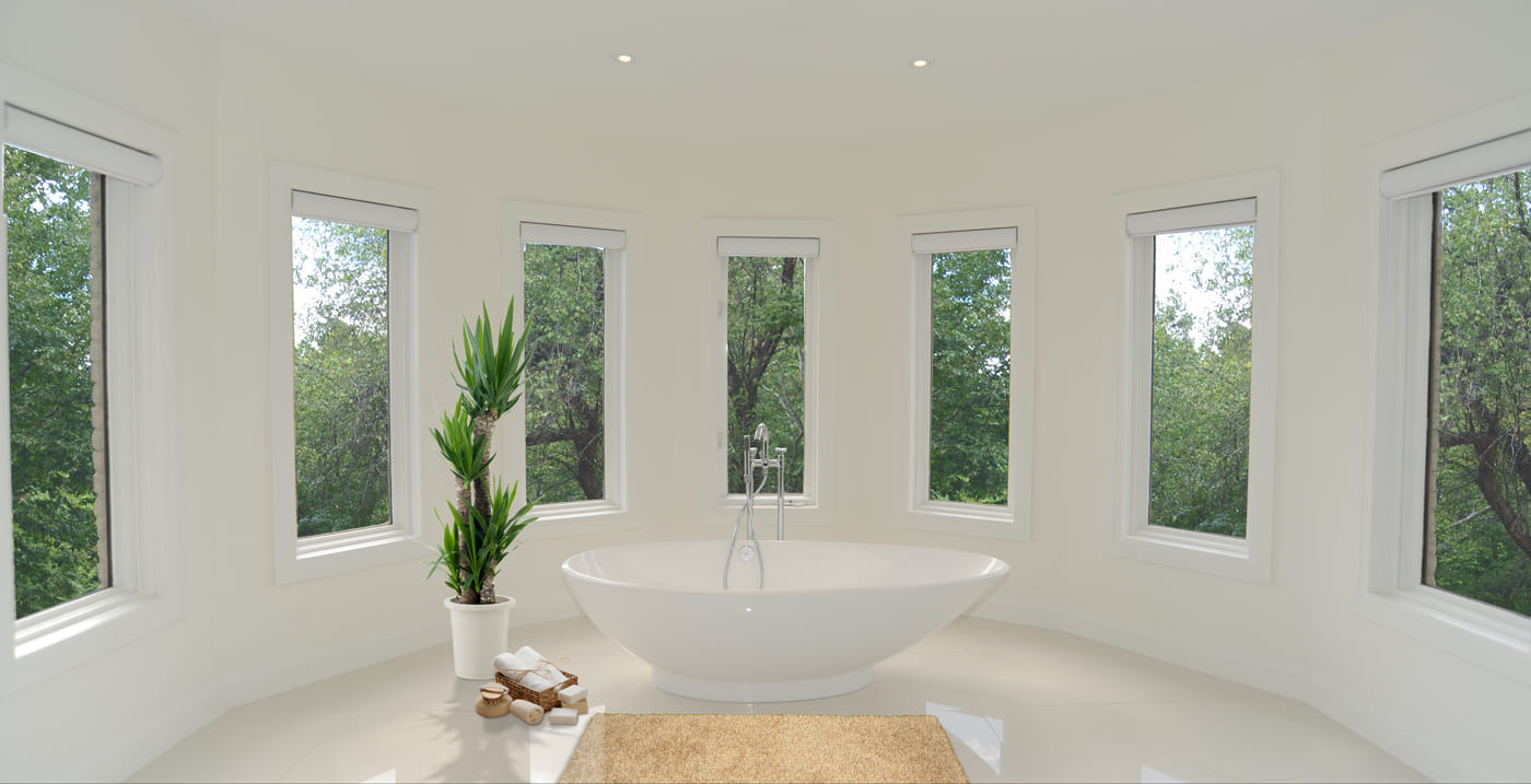 Luxury condo bathroom in Toronto with curved walls and window panels