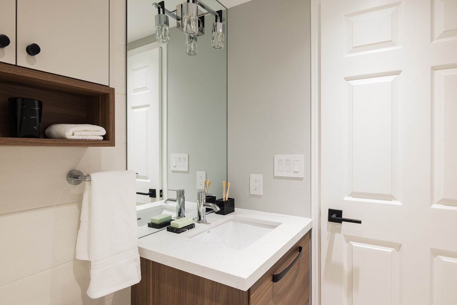 GTA condo bathroom renovation with white vanity top and wood base