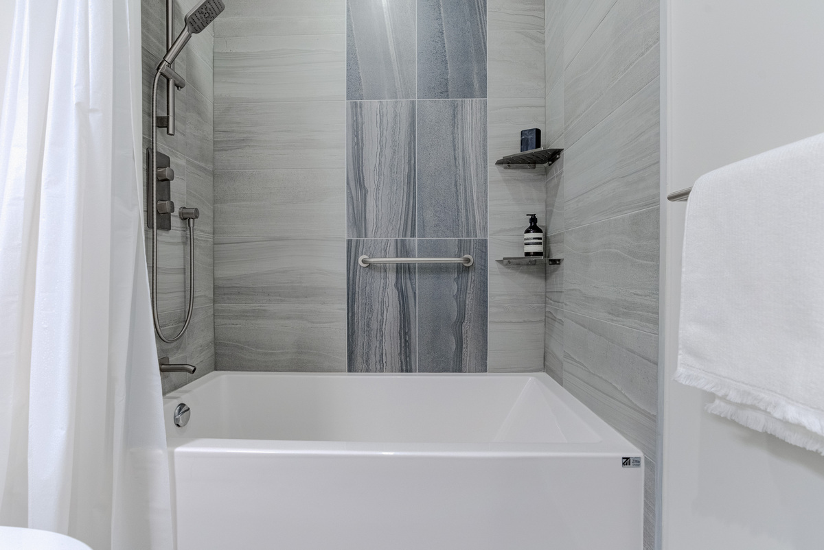 Tub and shower combo in GTA condo bathroom renovation by Golden Bee Condos