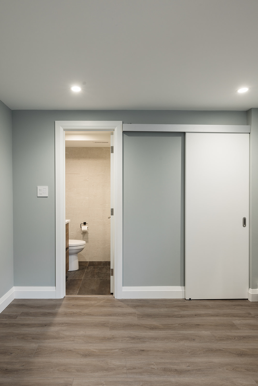 Door open to bathroom in downtown Toronto full condo renovation
