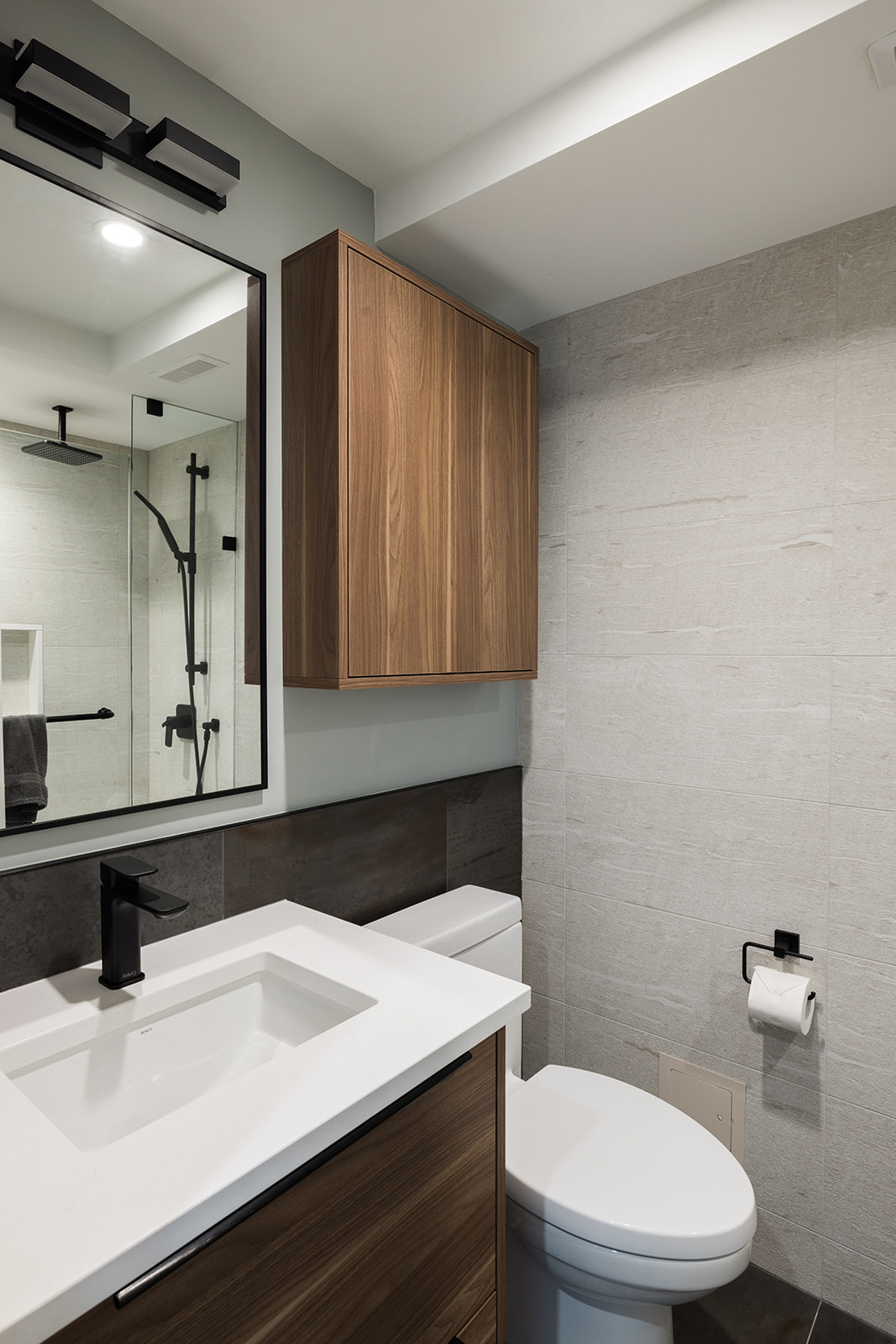 Downtown Toronto condo bathroom renovation with built-in storage above toilet