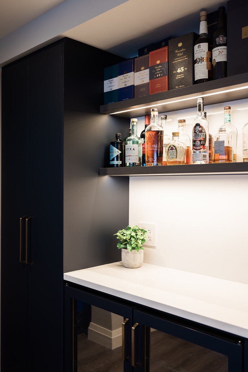 Downtown Toronto condo renovation shot of custom beverage station with shelving and built-in wine fridge