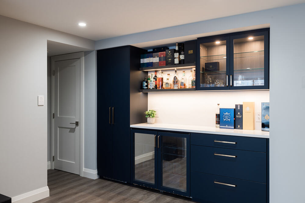 Downtown Toronto full condo renovation view of custom beverage station with built-in shelving and wine fridge