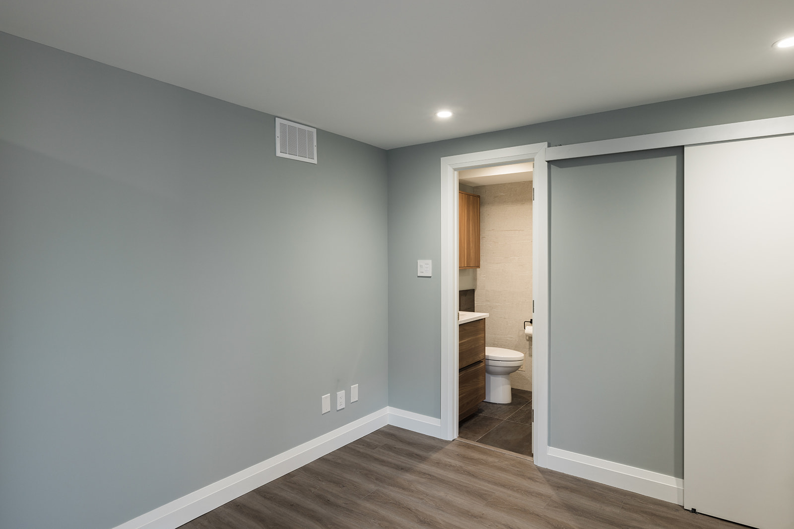 Full condo renovation in downtown Toronto with recessed lighting and LVP flooring