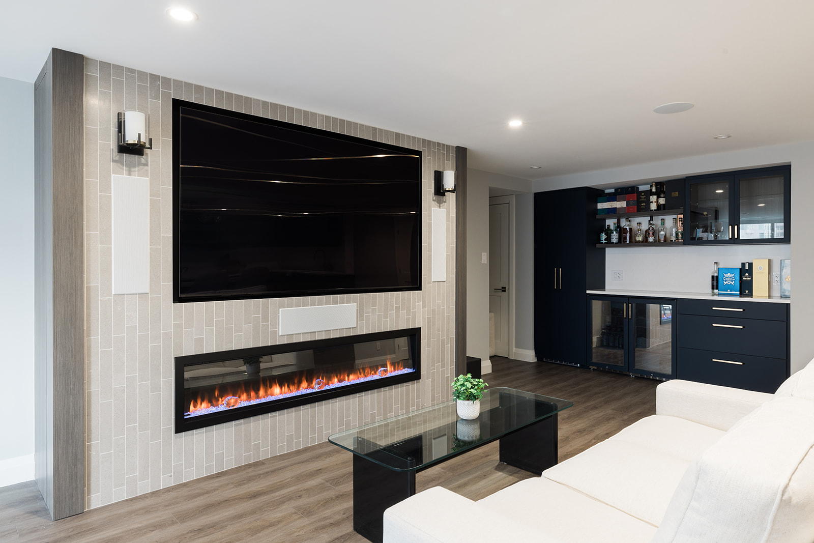 View of custom fireplace in luxury downtown Toronto condo renovation in living room area with mounted flatscreen TV