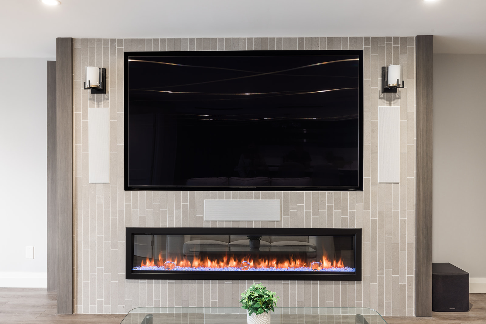 View of custom fireplace in luxury downtown Toronto condo renovation with vertical tiling surround