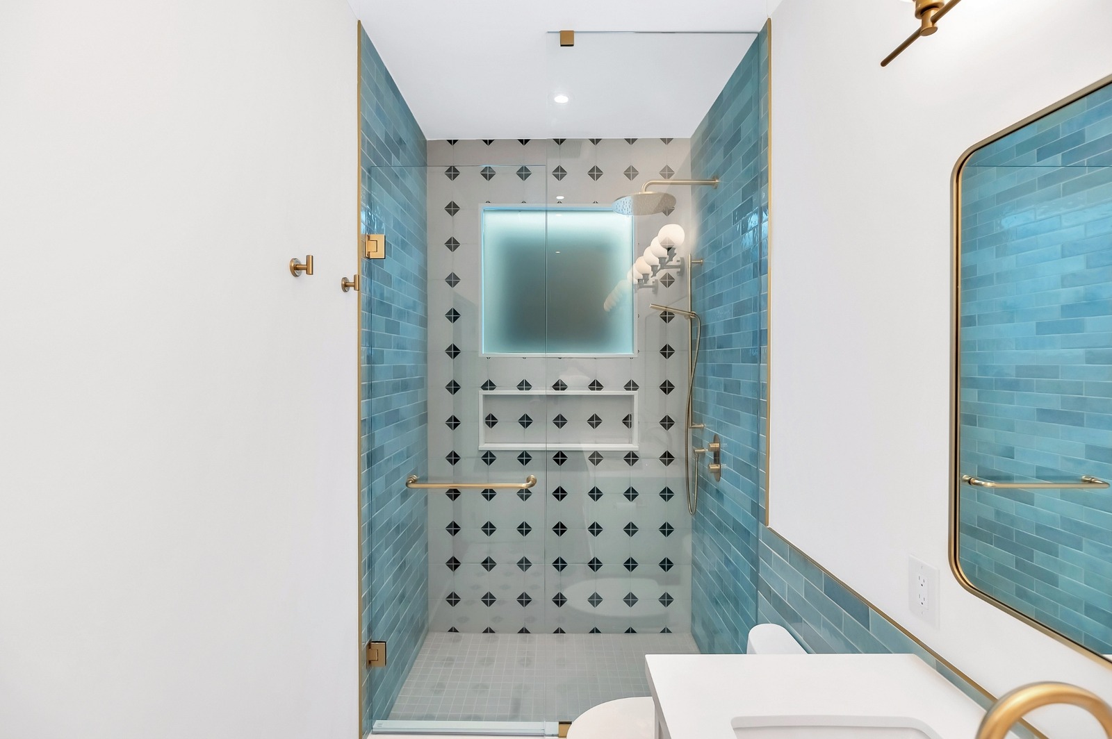Blue subway tile in shower with niche bathroom renovation condo in Toronto
